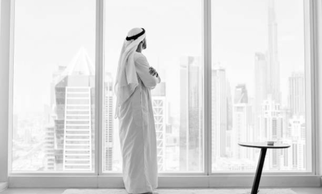side-view-of-arab-businessman-looking-through-window-in-modern-office__1__jpeg_copy_jpeg